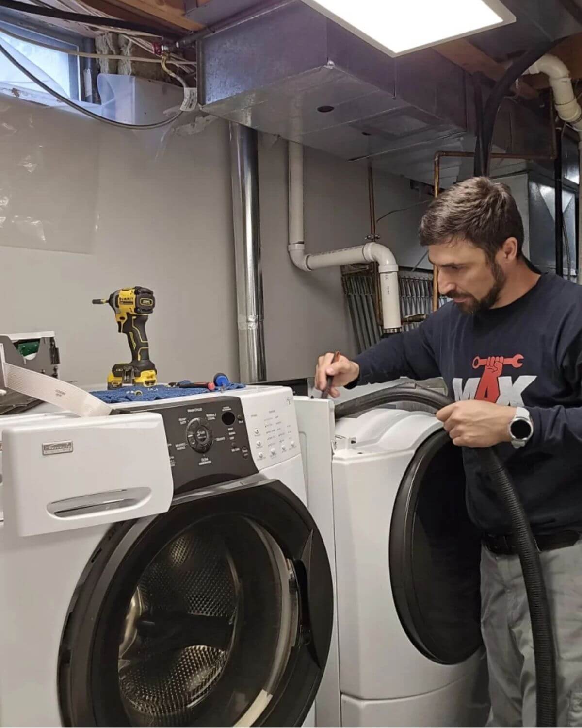 Certified appliance repair technician servicing a front-load washer and dryer in Carolina Forest, SC 